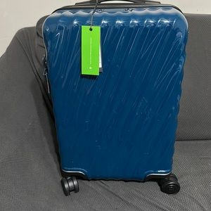 TUMI international expandable 4 wheeled carry on - blue - slightly used